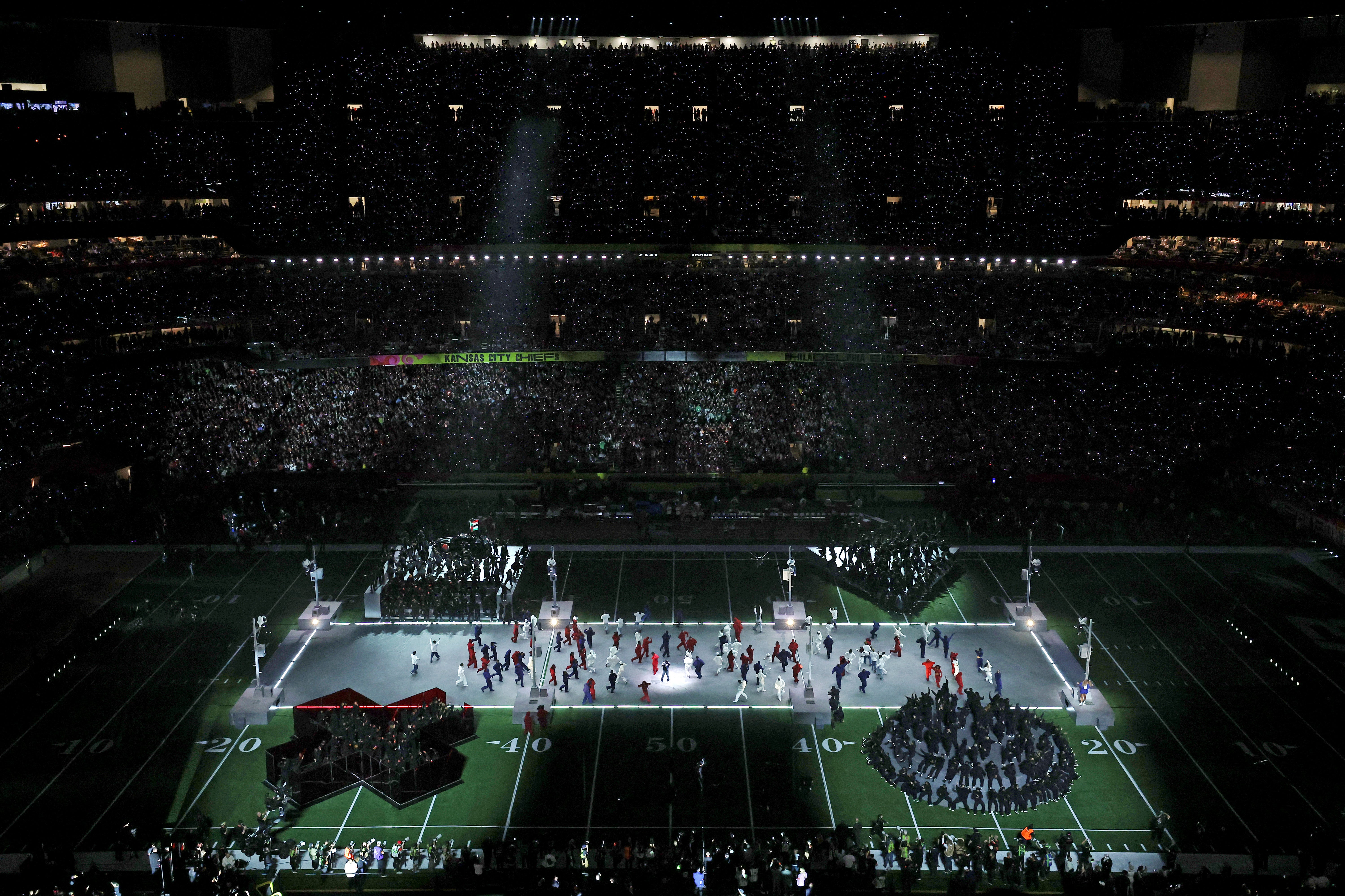 Nantambu is accused of jumping off stage and running across the field before being tackled by several men in suits.
