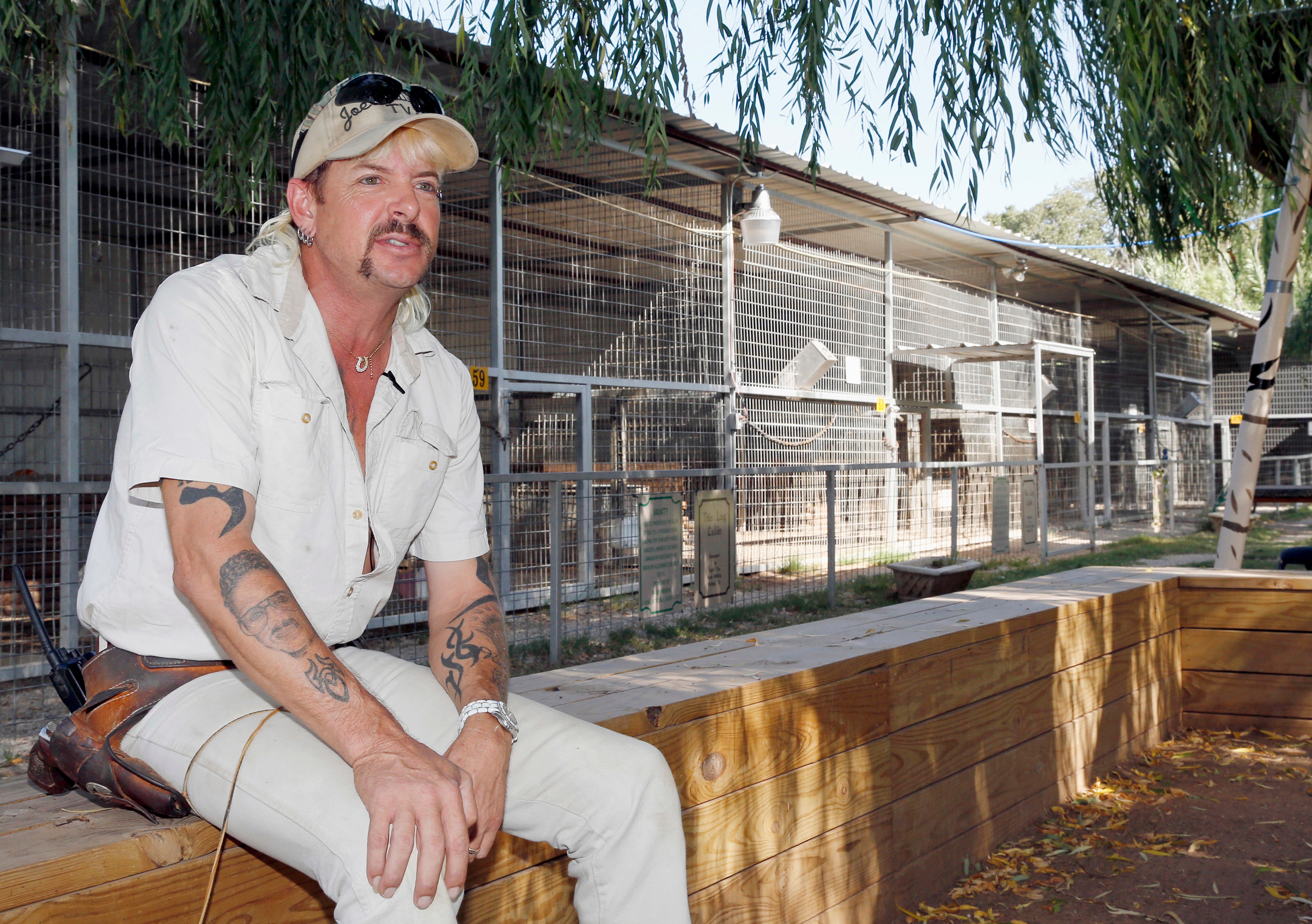 Joseph Maldonado answers a question during an interview at the zoo he runs in Wynnewood, Okla., on Aug. 28, 2013. (AP Photo/Sue Ogrocki, File)