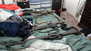 At Benton’s Snohomish home, agents seized a fully automatic M16-style rifle, an uninstalled auto sear, and two unregistered short-barreled rifles.