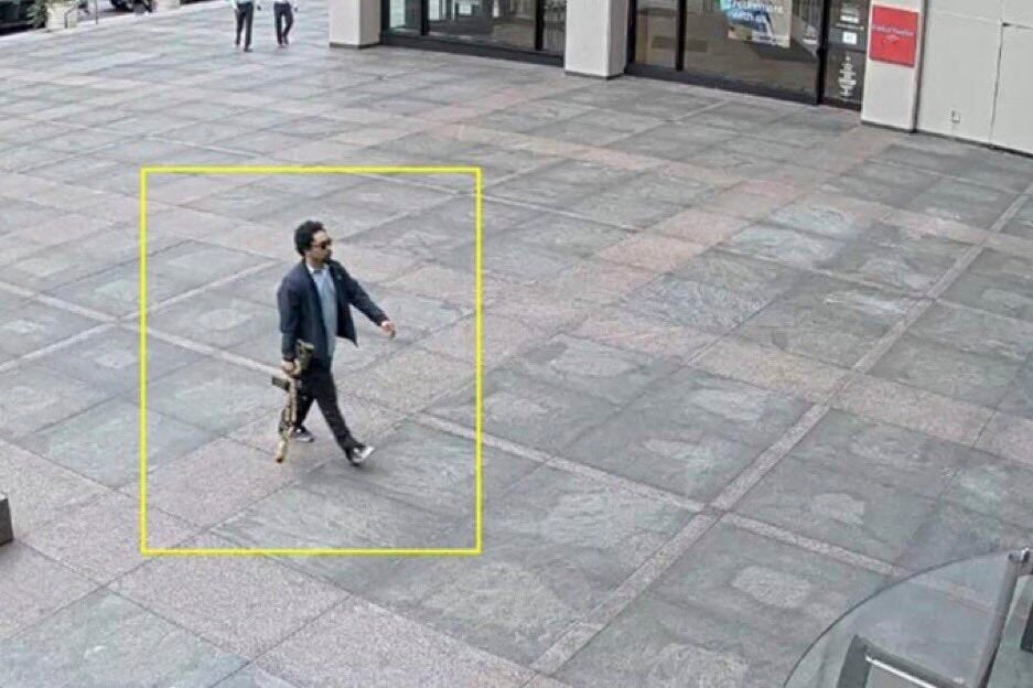 Tamura was seen on surveillance walking toward the lobby of 345 Park Avenue, armed with the rifle.