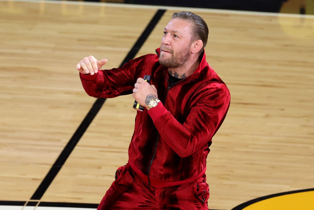 Conor McGregor is seen on the court during a timeout at Game Four of the NBA Finals between the Denver Nuggets and the Miami Heat at Kaseya Center on June 9, 2023