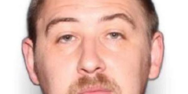 Infant Survives as Family of Four Found Slain in Lake County; Suspect at Large