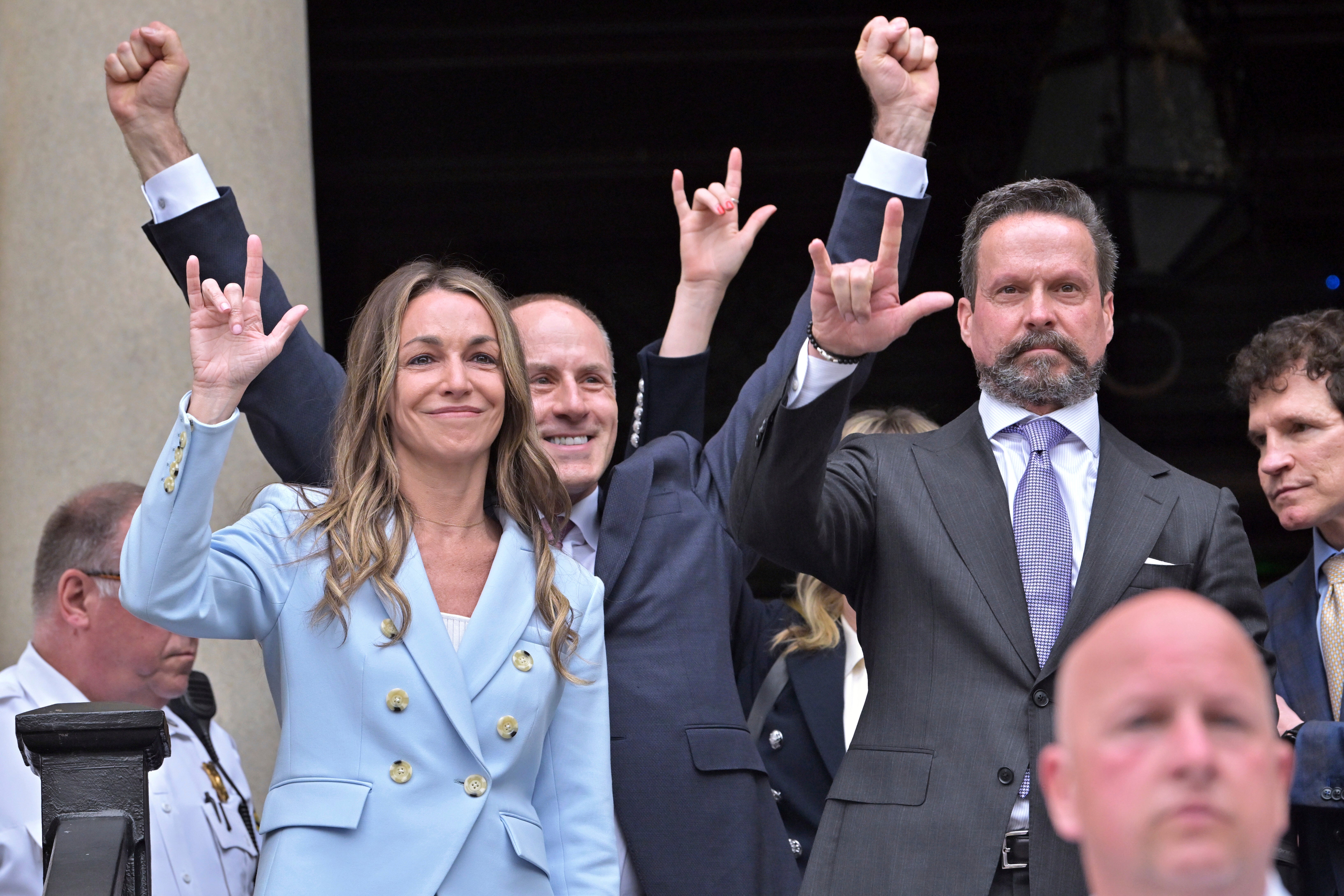 Karen Read gestures to supporters after she was found not guilty of second-degree murder on Wednesday, June 18, 2025, in Dedham, Mass