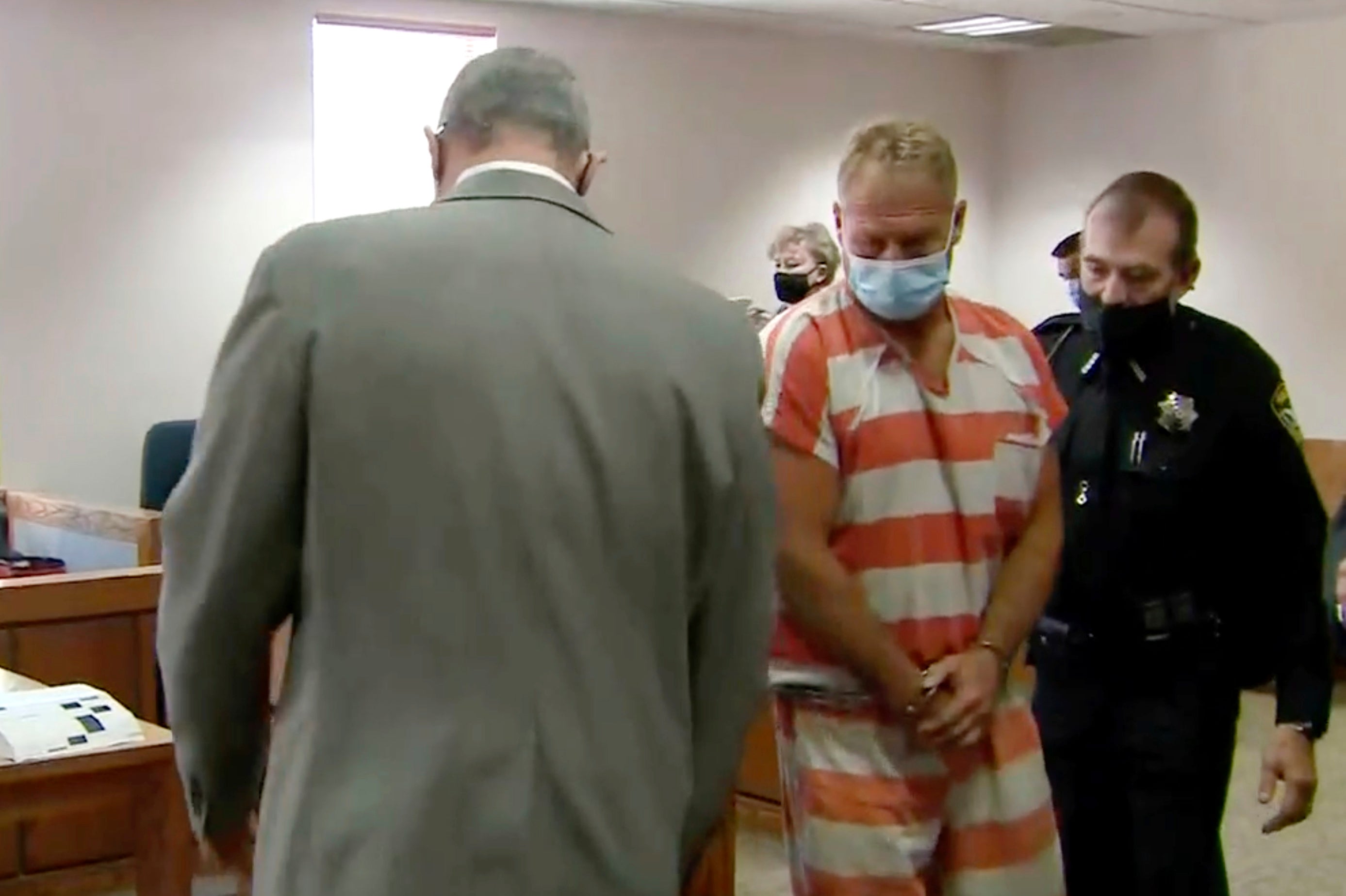 In this still image from video, Barry Morphew, center, appears in court in Salida, Colo., Thursday, May 6, 2021. (KUSA via AP, Pool, File)