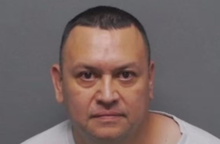 Robert Herrera, 52, is accused of posting a comment to a Facebook, in response to a news story regarding the president’s visit, saying,