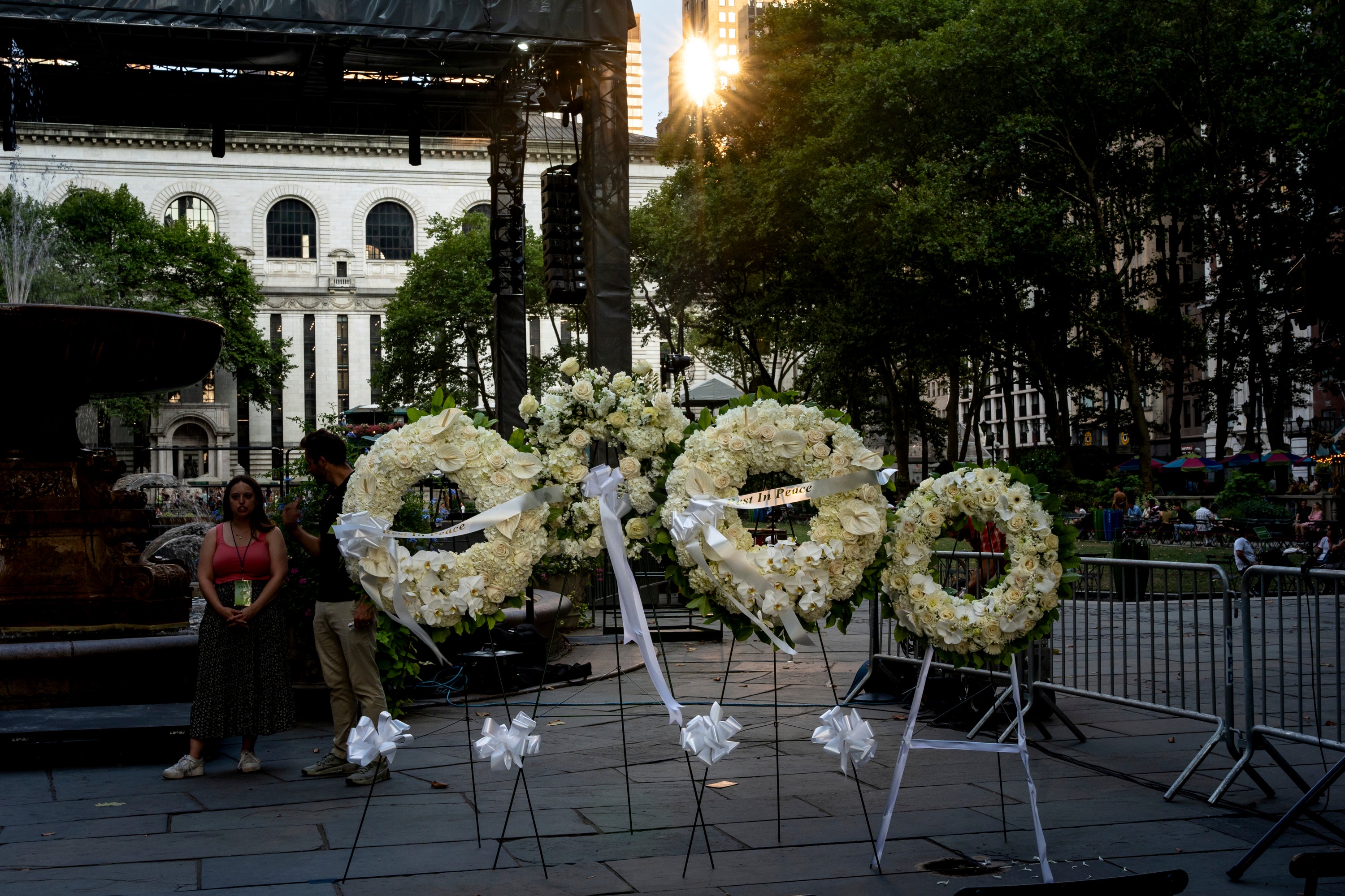 Wreaths with a ribbon that reads ‘Rest In Peace’ are seen displayed at a vigil for those killed by a gunman who opened fire in a Midtown Manhattan office building on Monday