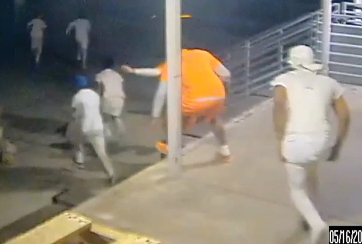 Inmates at Orleans Justice Center flee out of a loading dock on Friday, May 16