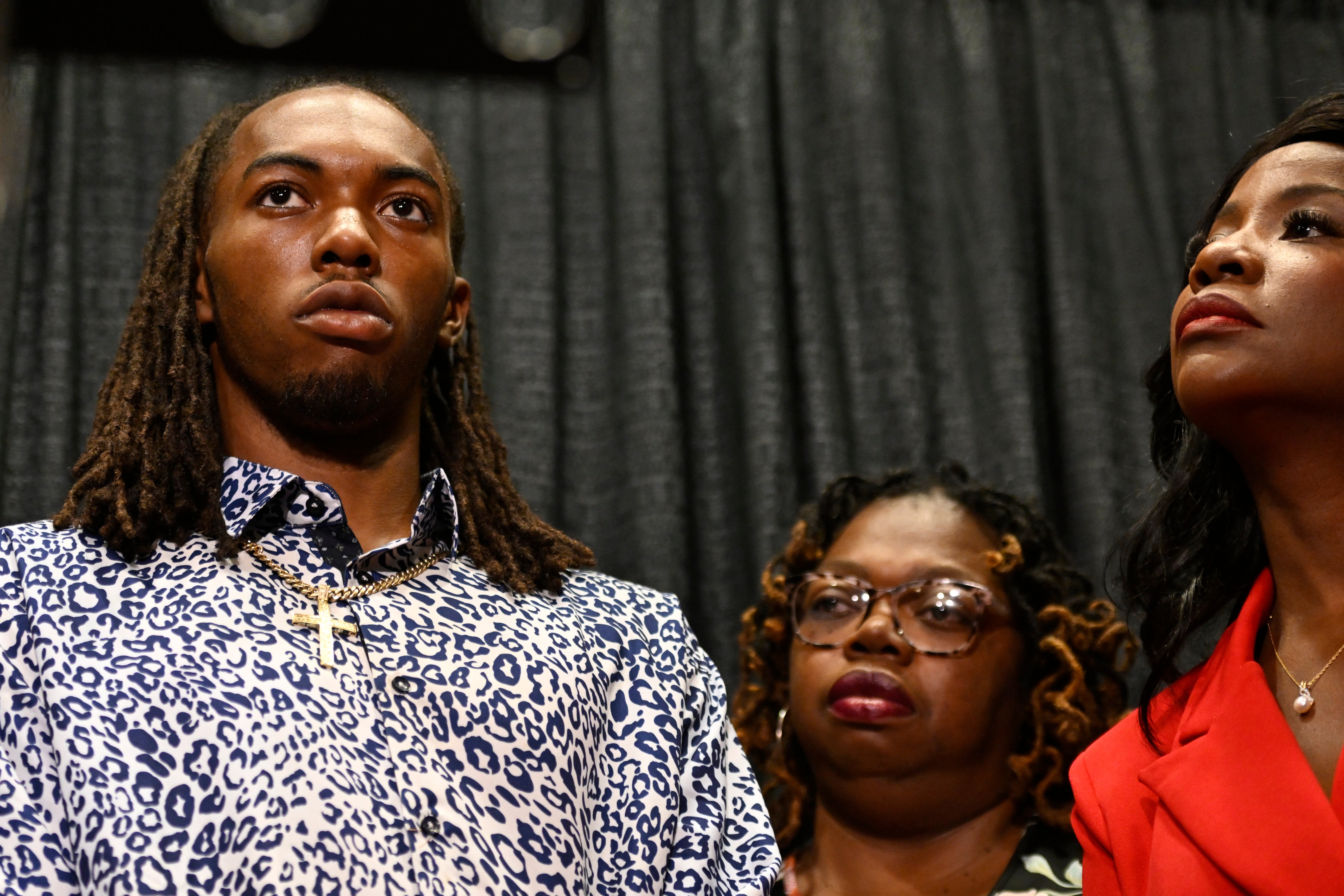 William McNeil Jr. with his mother Latoya Solomon, center, and attorney Sue-Ann Robinson, right