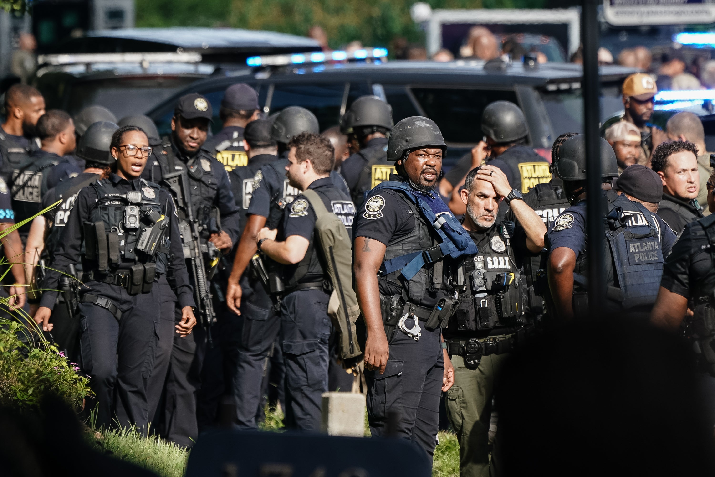 Officers respond to the shooting near the CDC campus, where four buildings were struck