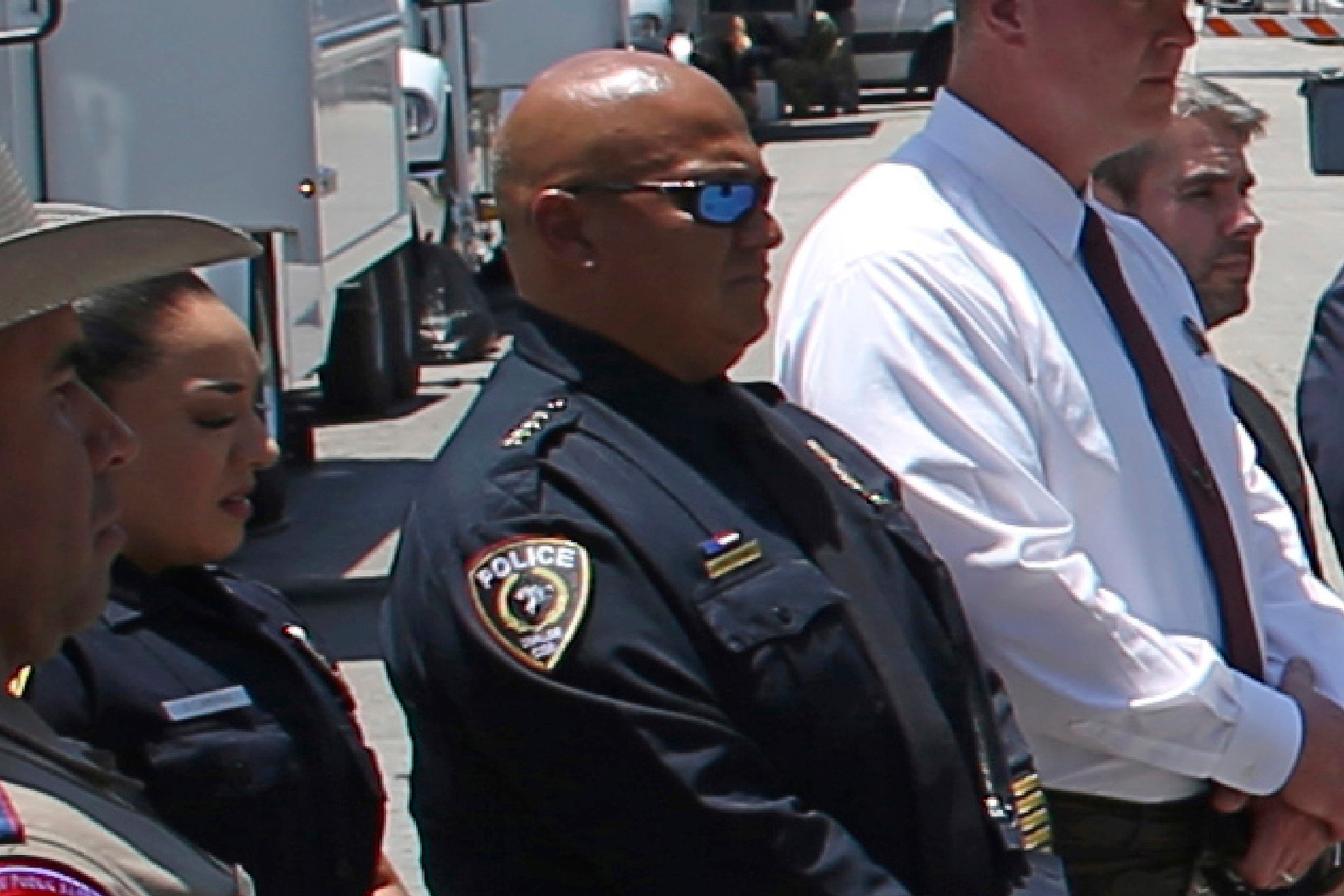 Then-Uvalde School Police Chief Pete Arredondo, center, attends a news conference outside of Robb Elementary school on May 26 2022