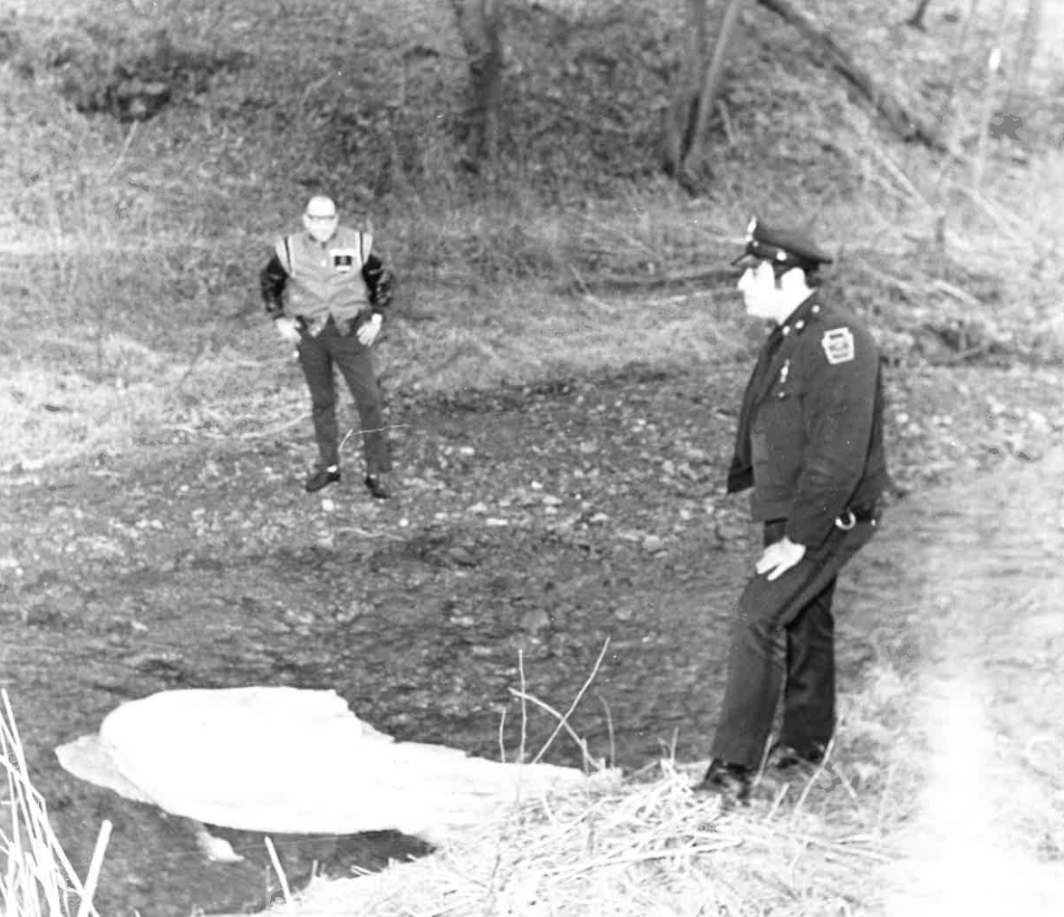 Police investigate the scene of Annette Tokarz's murder. Investigators originally believed Cornelius McCoy could be responsible, but Detective Patrick Young ruled him out