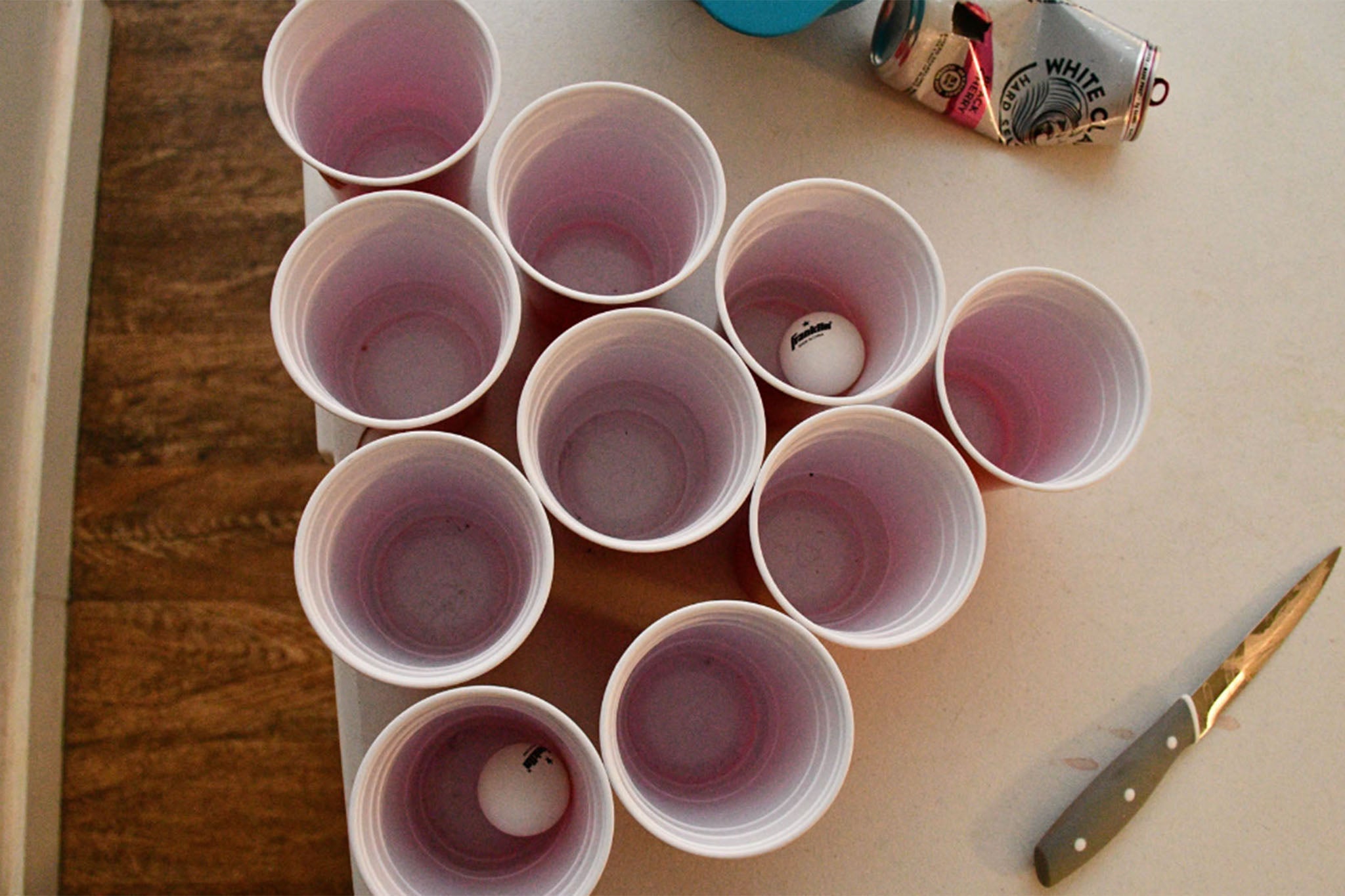 Red solo cups were set up for a beer pong game. A knife was found on the table. The murder weapon, however, has never been found