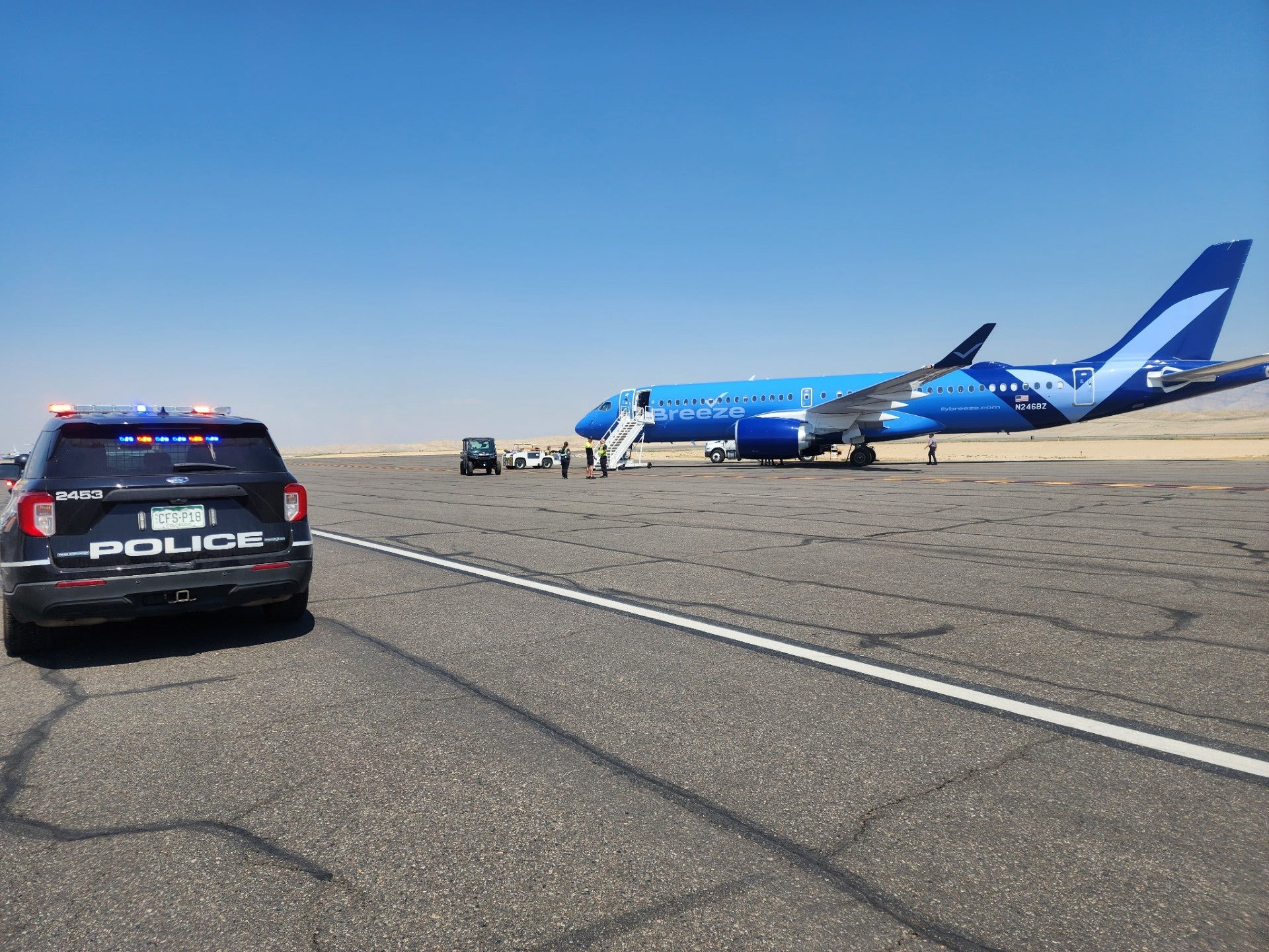 The Breeze Airways flight to Los Angeles was diverted to Colorado after a drunk passenger started shouting racists slurs while waving a skateboard, police say