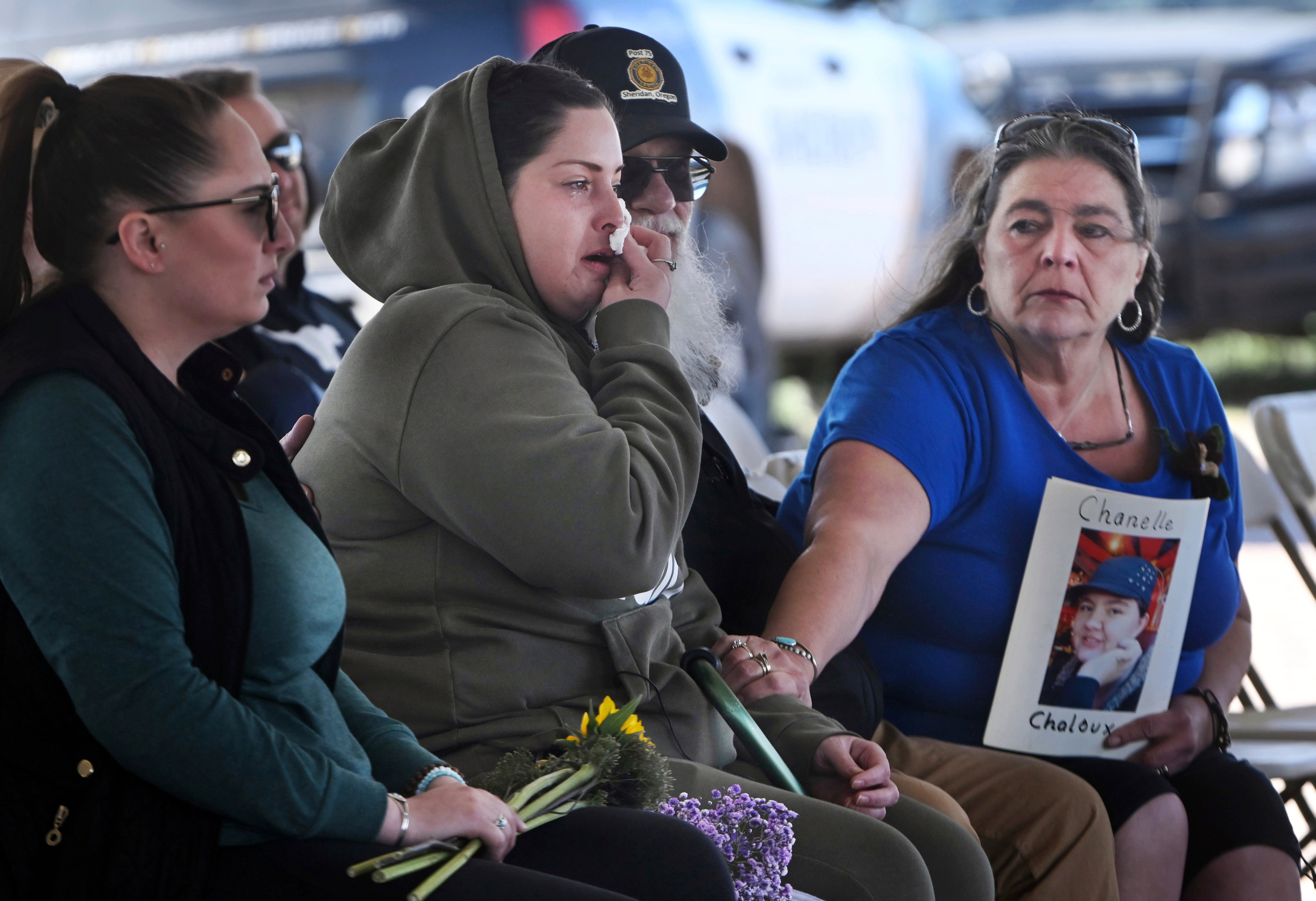 Angelika Steadman, right, reaches over to comfort Samantha Naranjo, whose grandmother Dorothy Tardif, was among the bodies found at the Return to Nature Funeral Home and Steadman's daughter, Chanelle Chaloux, has yet to be found, during a small ceremony before the start of demolition of the funeral home in Penrose, Colo., Tuesday, March 15, 2024. (Jerilee Bennett/The Gazette via AP, File)