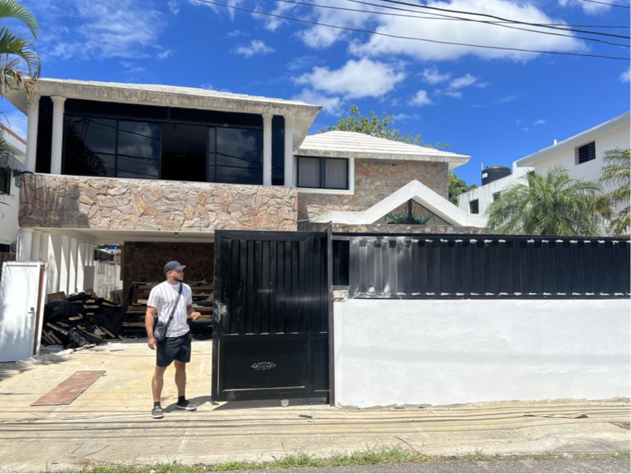 One of the defendants outside of a call center, which were typically run out of homes in the Dominican Republic, according to federal prosecutors