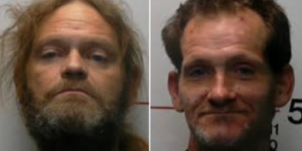 Two men arrested after body of pregnant woman found wrapped inside plastic storage tote