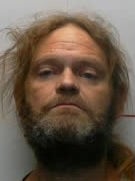 James Rothenbusch was arrested after a pregnant woman was found dead in a plastic tote, police say