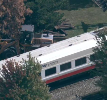 1 hurt after Amtrak train hits construction vehicle in Chicago suburbs, police say