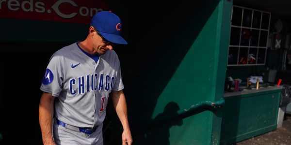 Surging Reds blank Cubs, move into tie for NL wild card spot