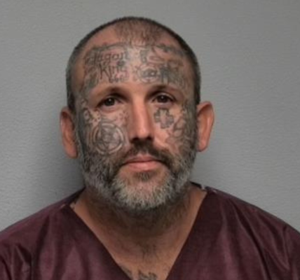 Tattoo-covered suspect accused of murdering mom and daughter served time for killing man and stuffing body in suitcase