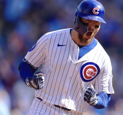 Busch stars as the Cubs beat the Cardinals 7-3 to clinch the top NL wild card