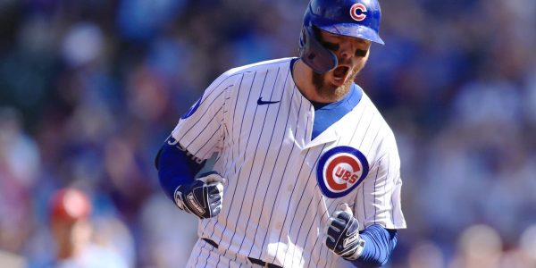 Busch stars as the Cubs beat the Cardinals 7-3 to clinch the top NL wild card