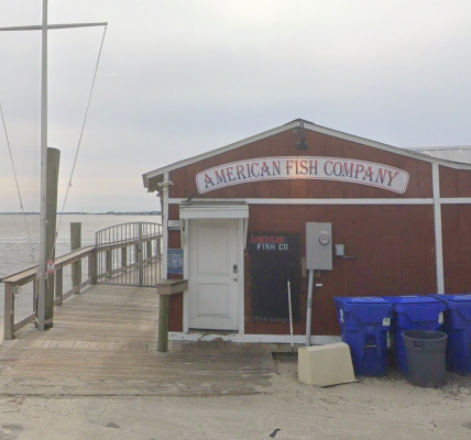 Three dead and six hurt after suspect opens fire from boat at North Carolina waterfront bar