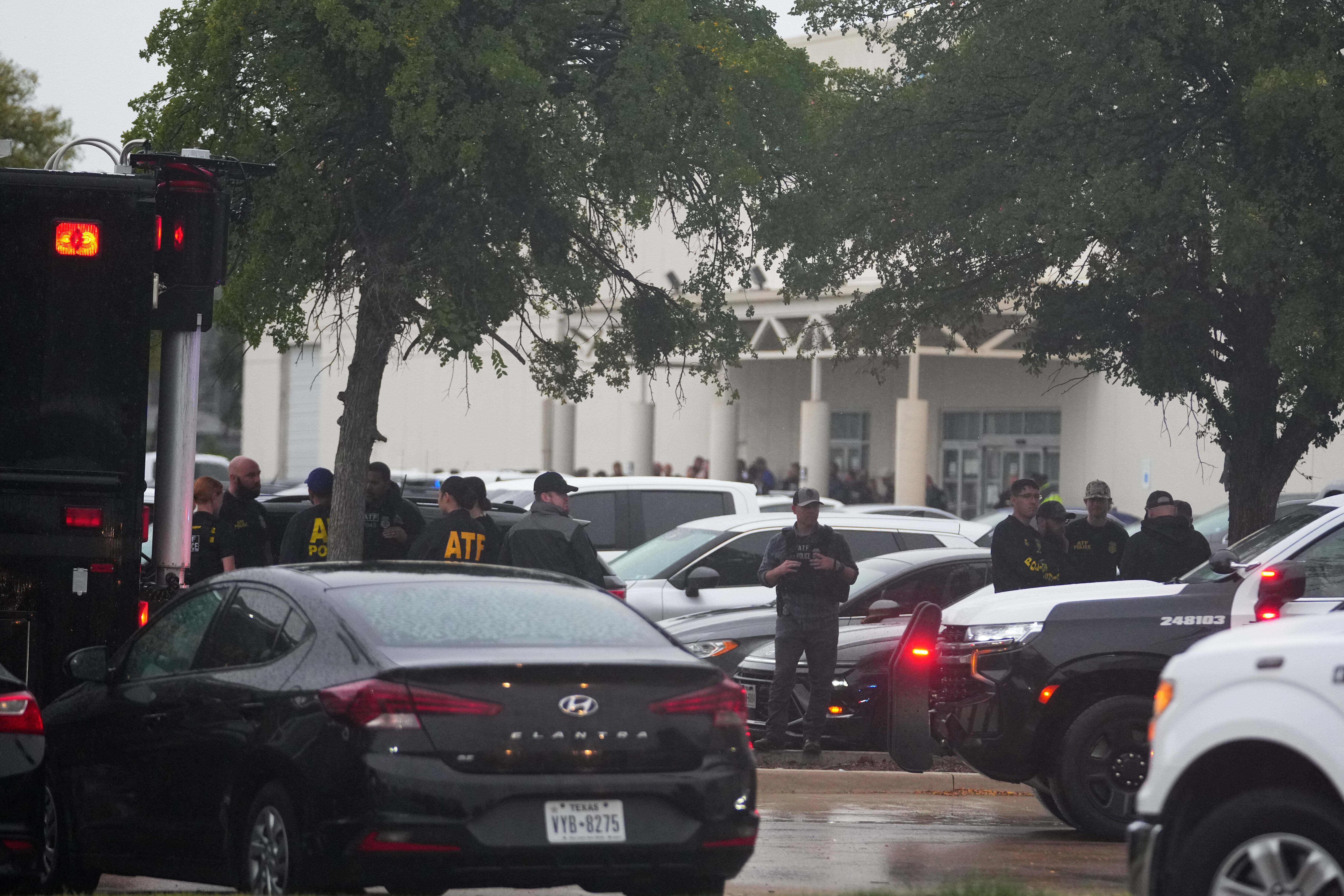 In total, four people were shot in the violence that unfolded Wednesday morning, including the suspect who died from a self-inflicted gunshot wound, Dallas police said