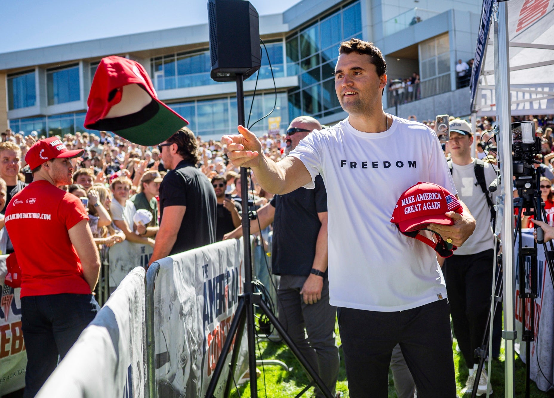 Charlie Kirk handed out hats before speaking at Utah Valley University in Orem, Utah