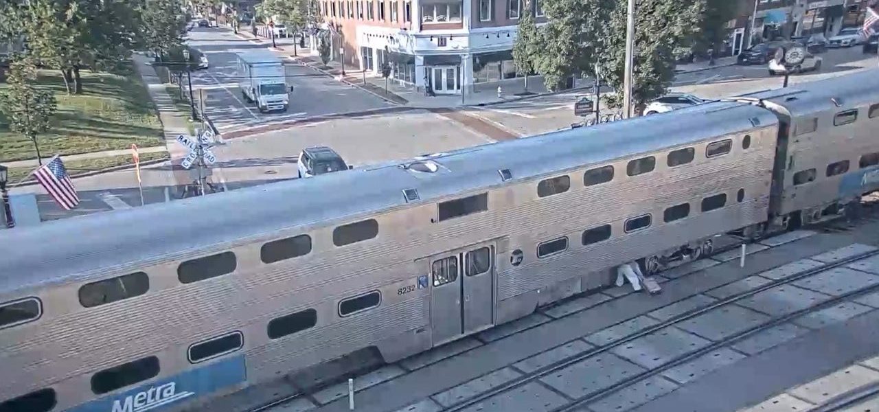 Commuter caught crawling under stopped Metra train in Chicago suburb, video shows