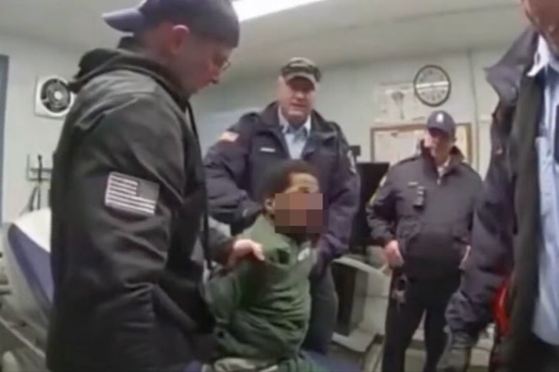 Bodycam footage shows Robert Brooks being beaten by guards while restrained on a medical exam table