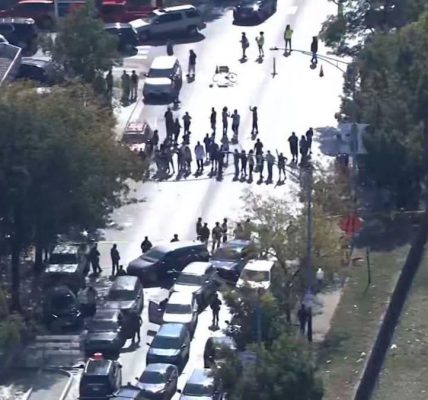 Chicago – A tense confrontation unfolded late Friday night when officers opened fire on an armed individual after multiple vehicles reportedly rammed into law enforcement units, according to a statement from the Department of Homeland Security (DHS).