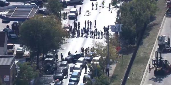 Chicago – A tense confrontation unfolded late Friday night when officers opened fire on an armed individual after multiple vehicles reportedly rammed into law enforcement units, according to a statement from the Department of Homeland Security (DHS).