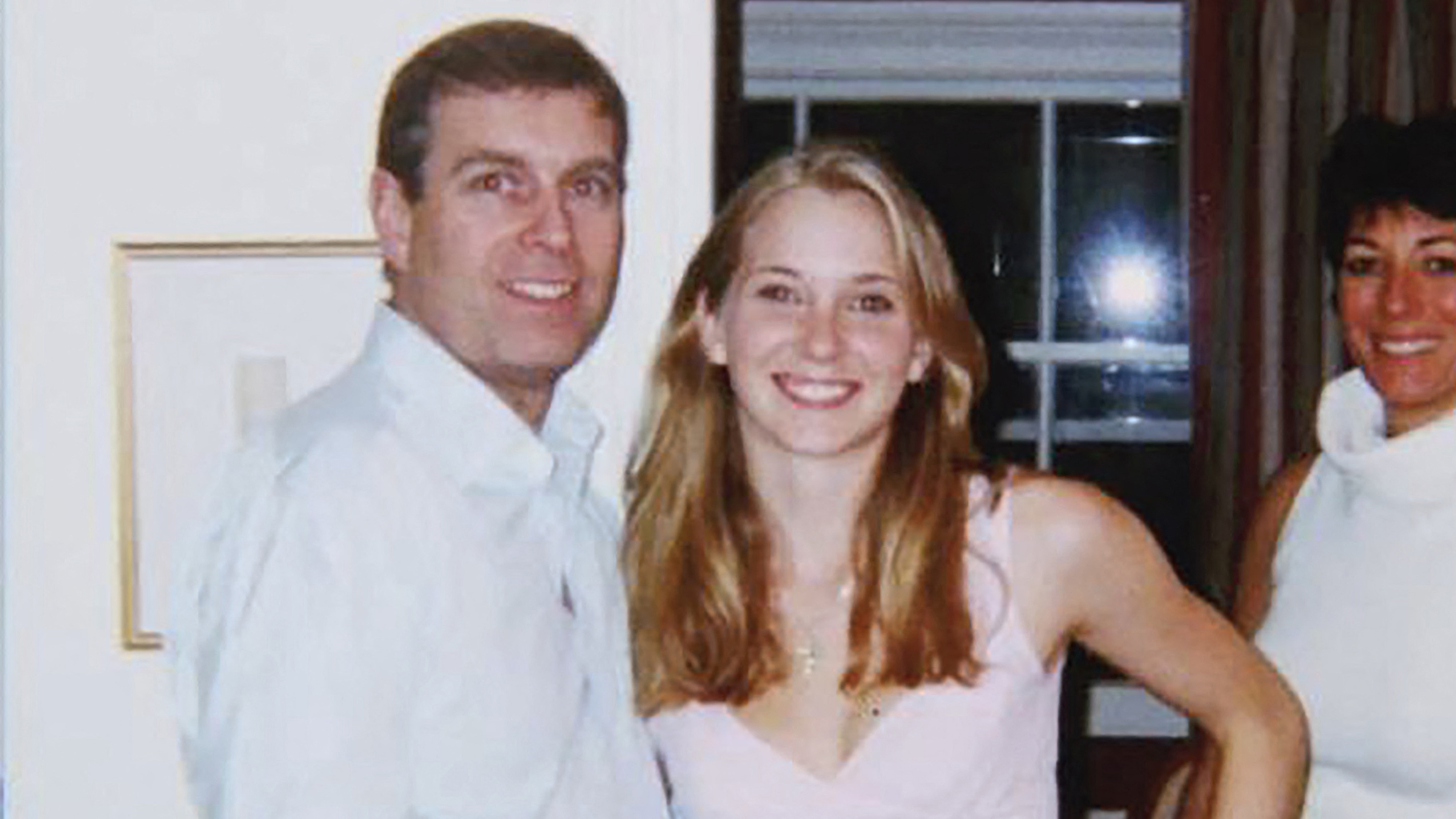 Giuffre (C) pictured with Prince Andrew and Ghislaine Maxwell