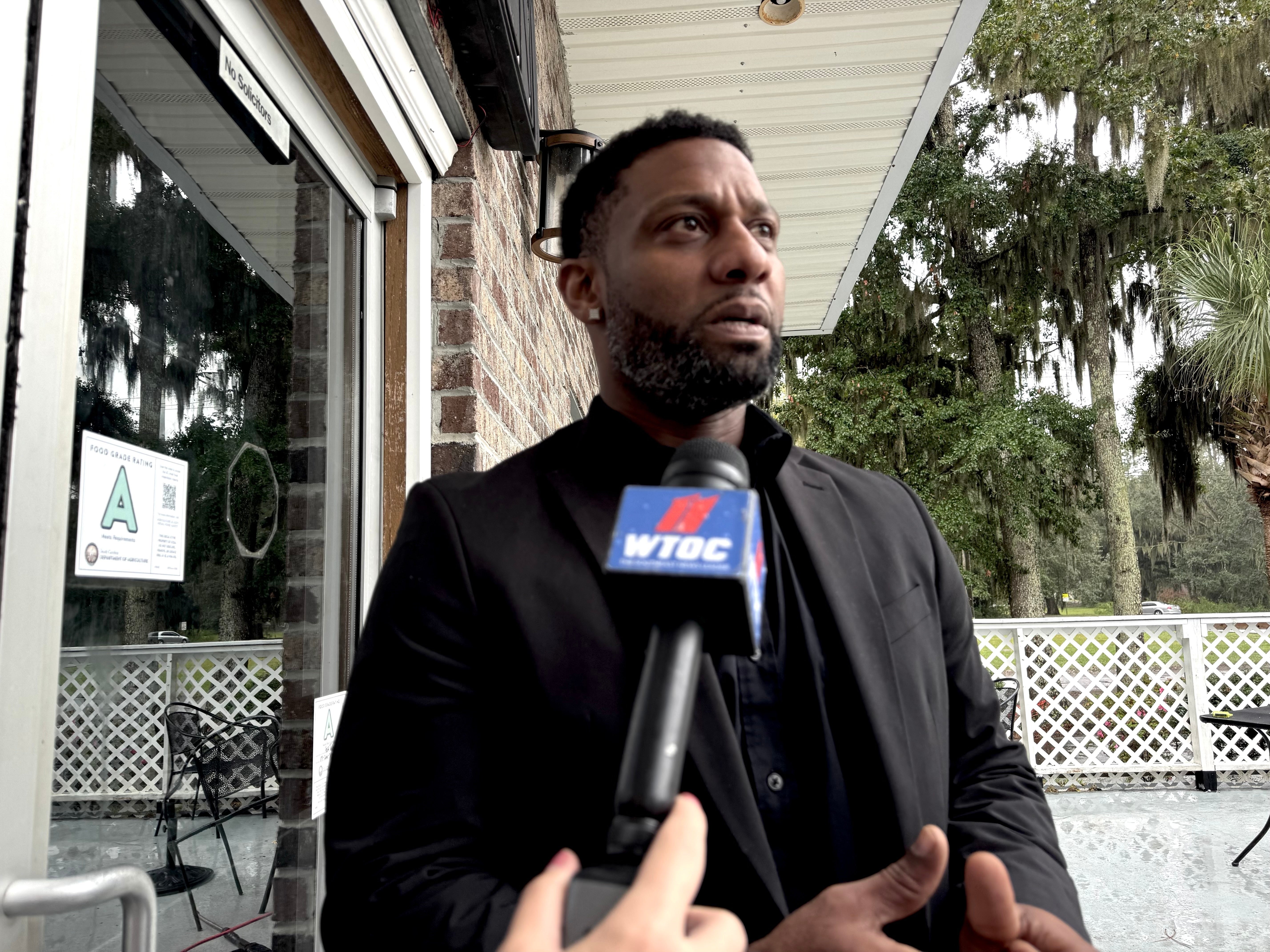 Owner Willie Turral talks to the media outside of Willie's Bar and Grill in St Helena Island, S.C. after a shooting occurred early Sunday, Oct. 12, 2025. (AP Photo/Lewis M. Levine)