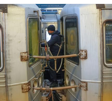 New York City – City officials are stepping up efforts to curb the dangerous practice of “subway surfing,” in which riders cling to the outside of moving subway trains