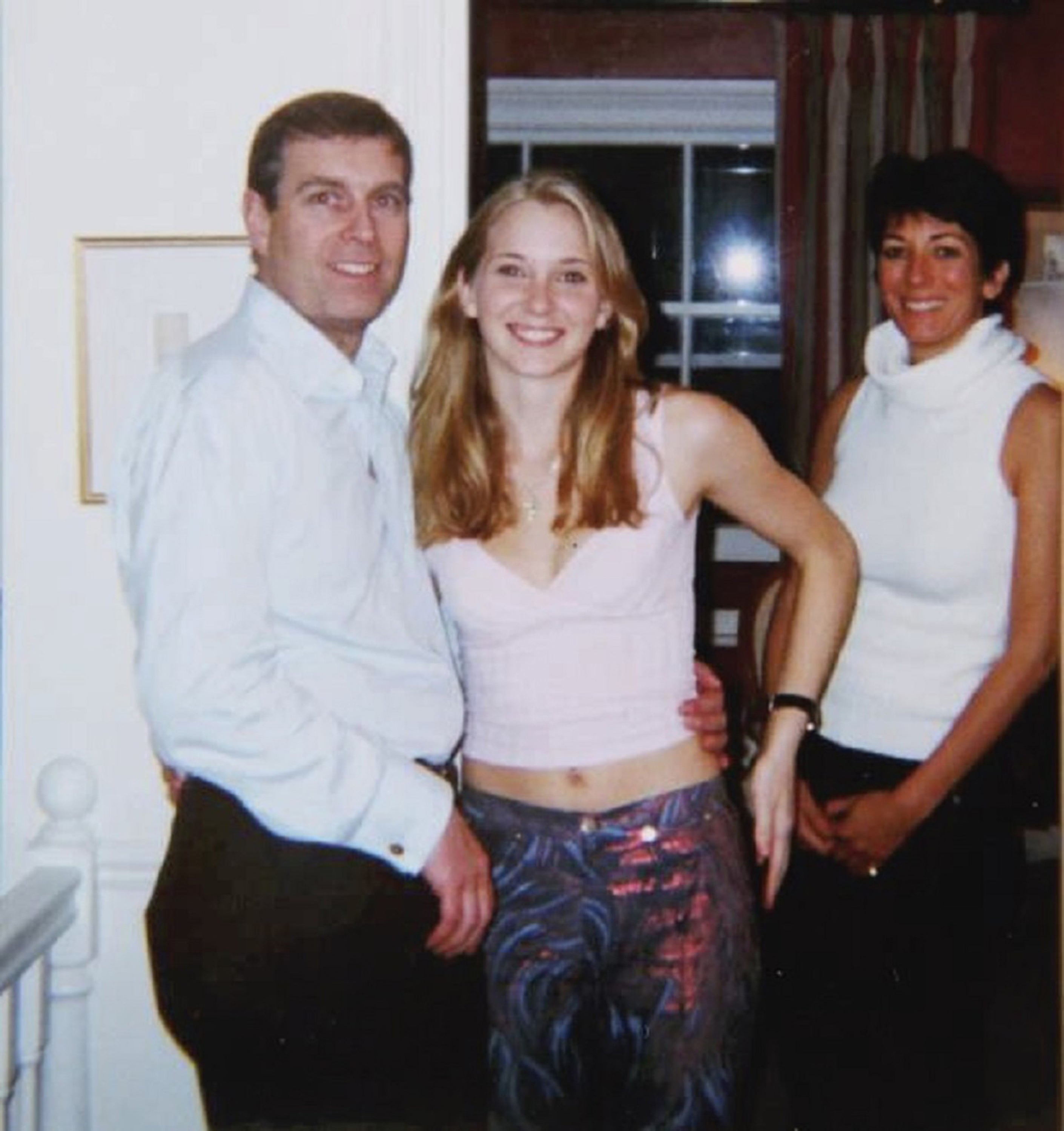 Virginia Giuffre wrote that Jeffrey Epstein took the photo of her with Prince Andrew on their first meeting