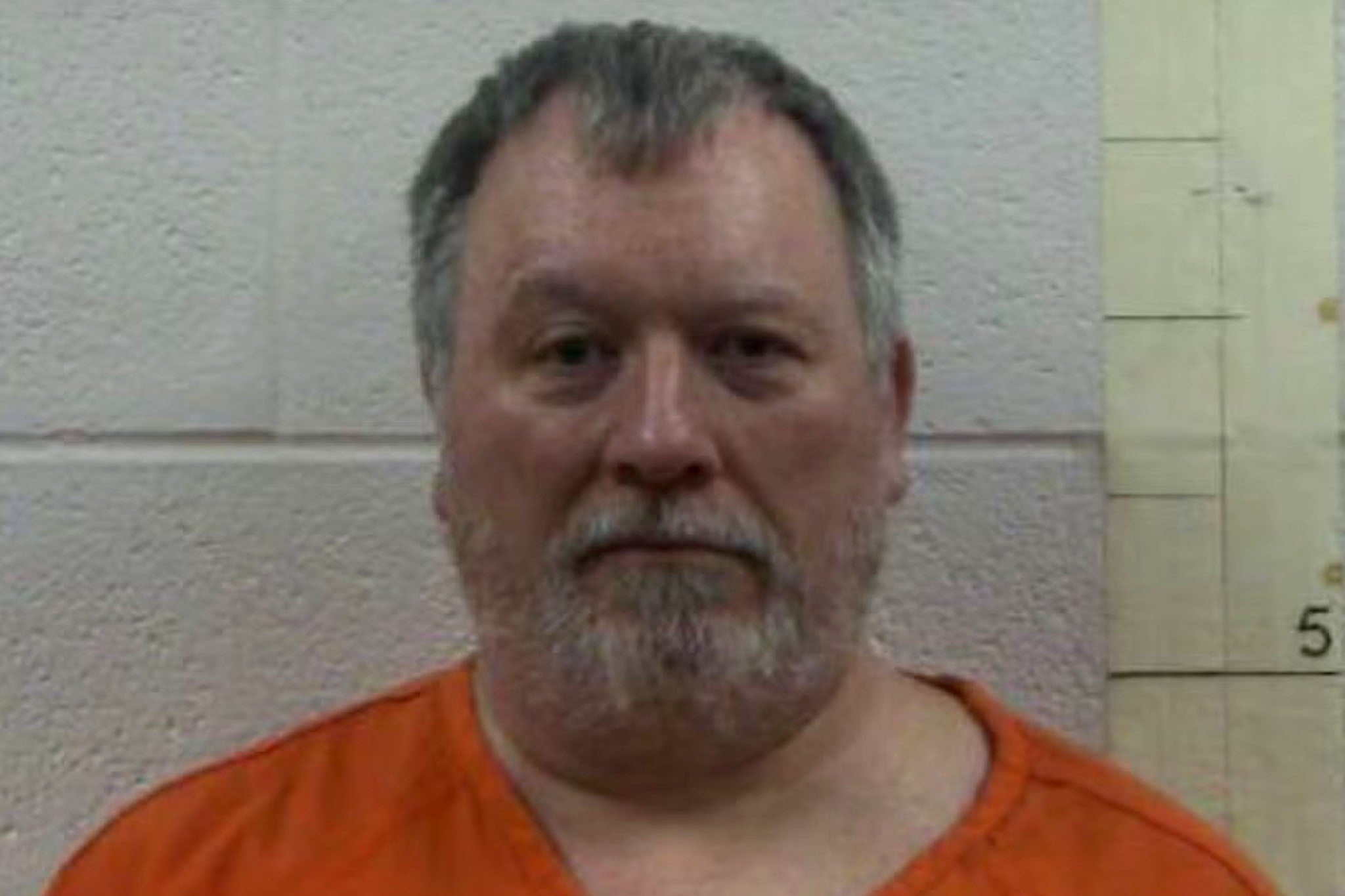 Larry Bushart Jr was arrested and charged with making threats of mass violence against a school after posting a meme in a Facebook group that was organizing a vigil for Charlie Kirk