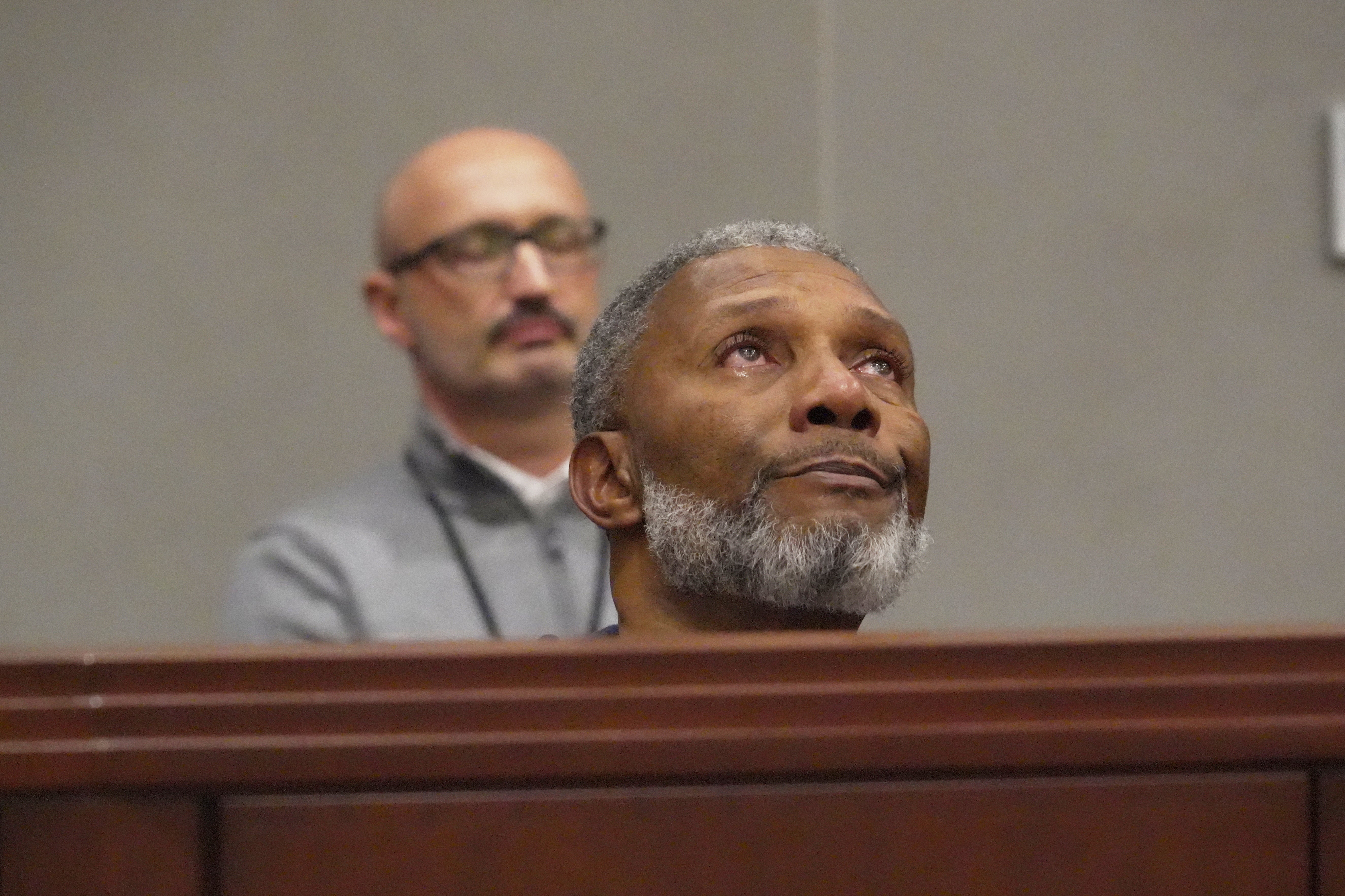 Tears well in Tracey Howard's eyes as he hears a prosecutor describe his wife Nicole Connors' murder during a hearing in Wake County Superior Court on Wednesday, Jan. 21, 2026, in Raleigh, N.C. (AP Photo/Allen G. Breed)